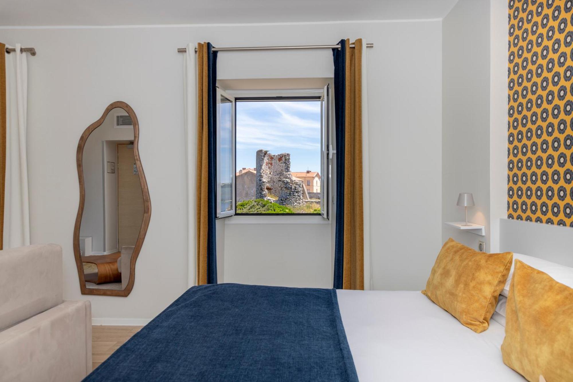 Junior Suite Balcony View of the Upper Town the Cliffs the Sea
